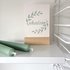 Kaart met envelop met Shalom (vrede) in gebroken wit met mintgroene letters en olijftakjes van Ahavah design