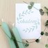 Kaart met envelop met Shalom (vrede) in gebroken wit met mintgroene letters en olijftakjes van Ahavah design